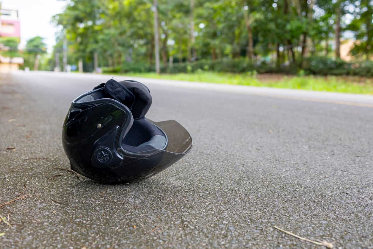 Motorcycle helmet on road after accident leading to $18.6 million verdict